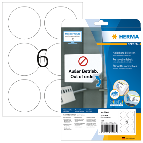 Ein Blatt mit sechs runden, leeren Etiketten und einer Verpackung für ablösbare Etiketten von Herma, die die Aufschrift "Außer Betrieb" enthält.